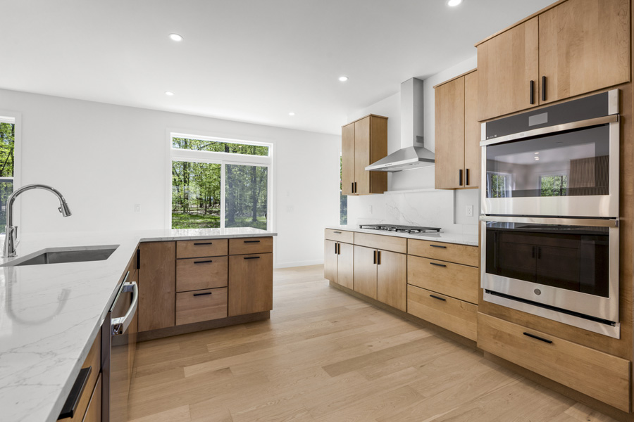  Beautiful kitchen with cooktop/double wall oven and seating at peninsula.  Homesite 5 at Hidden Glen in Millbrook, NY